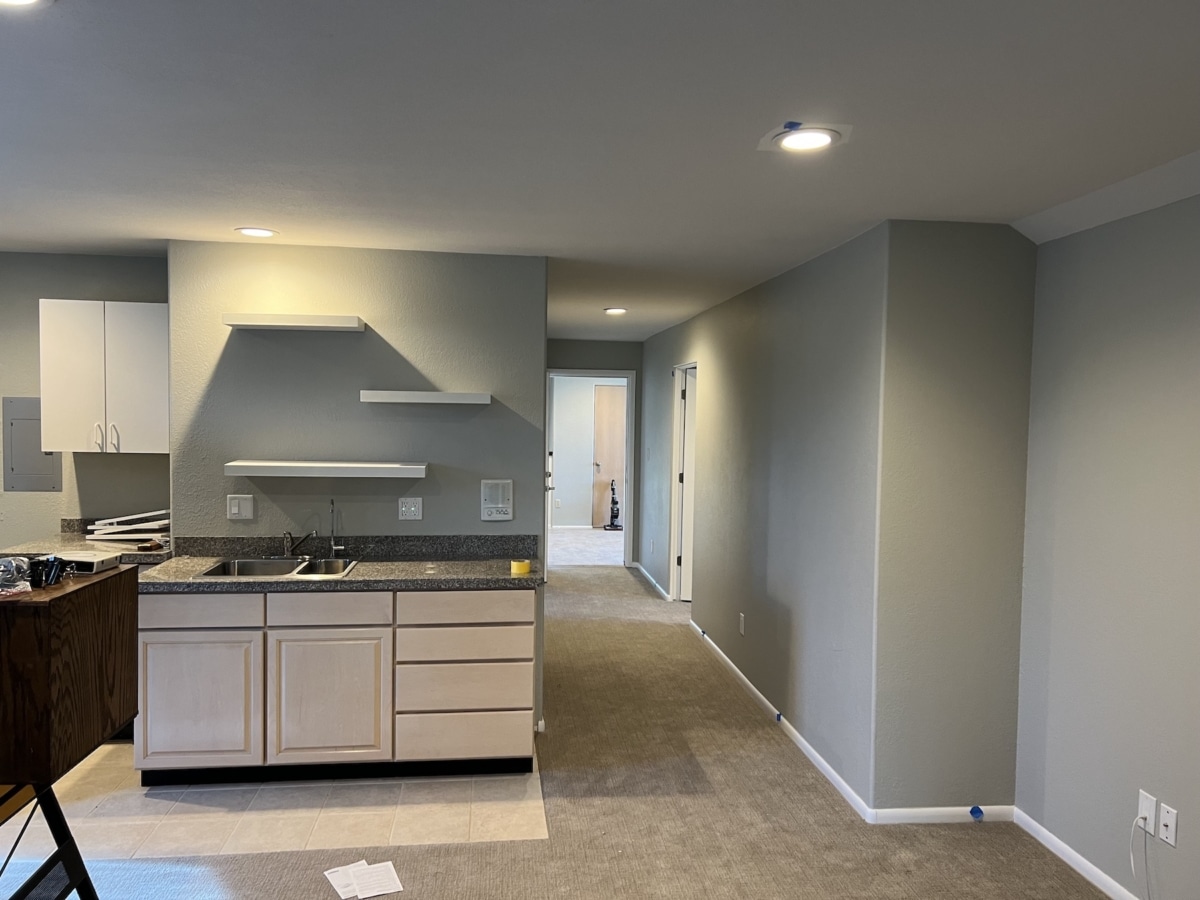 This image showcases the professional painting work by Elk Horn Painting, with smooth, light-gray walls, a clean white ceiling, and neatly painted cabinets that create a fresh and modern look in the space.