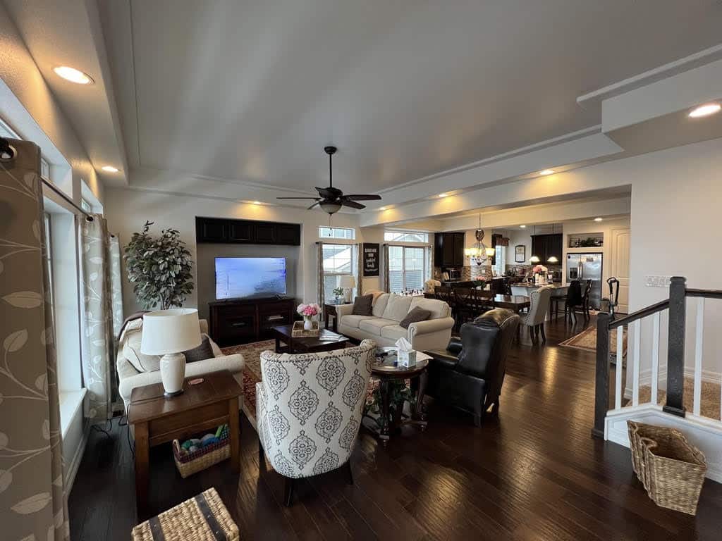 A cozy living area featuring freshly painted walls in a neutral tone, complemented by natural light and modern furniture, creating a welcoming and refreshed ambiance.