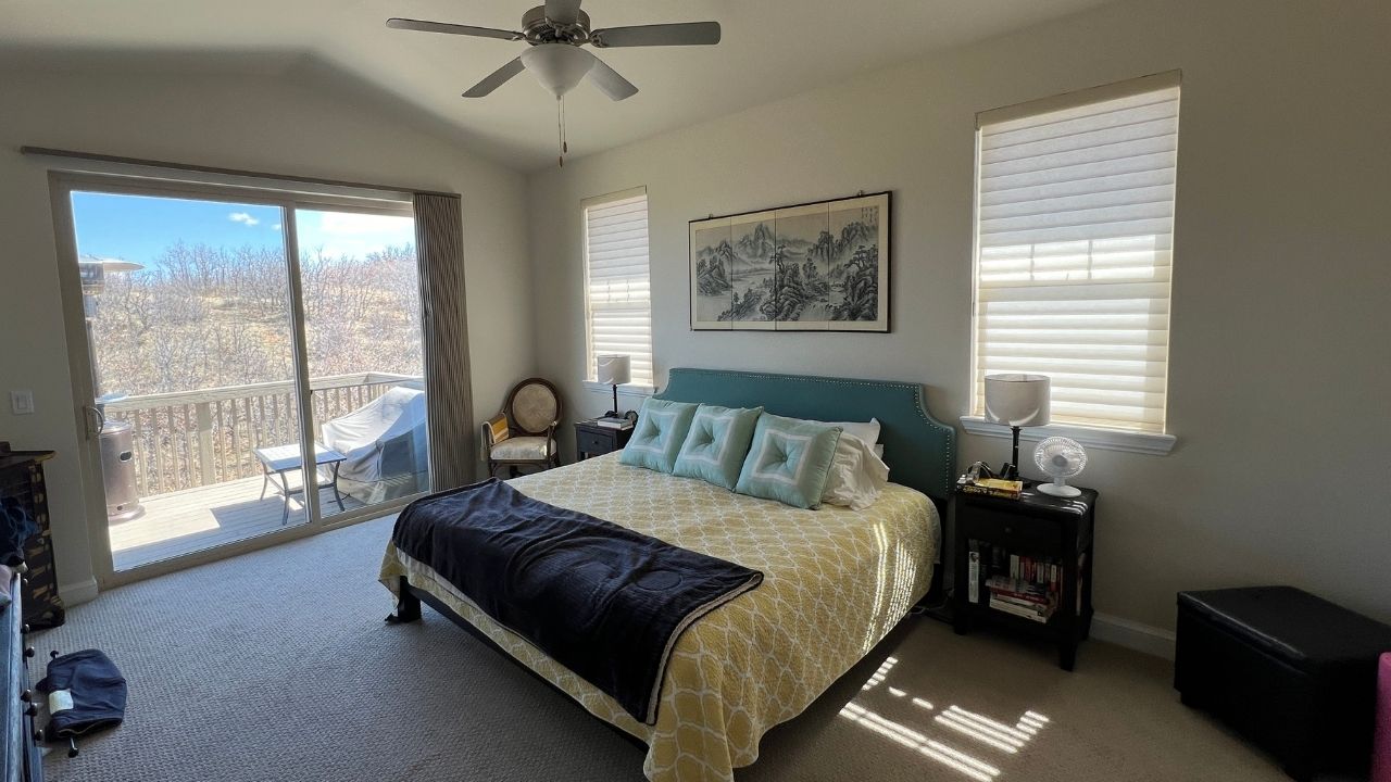 A bedroom with newly painted fresh off-white finish by Elk Horn Painting.