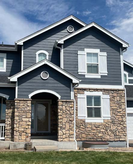 curb view of a home that was painted by Elk Horn Painting