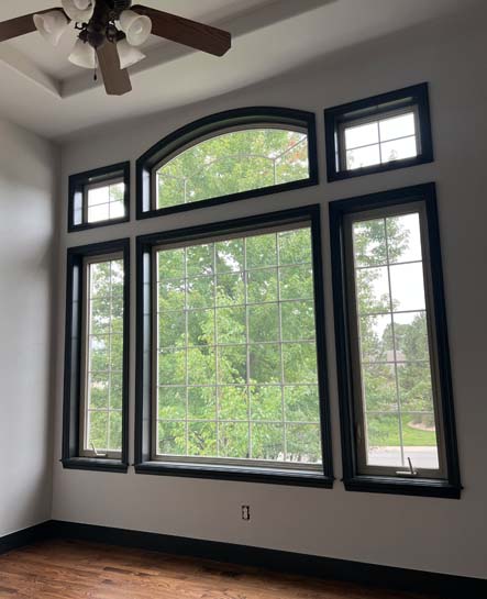 Photo of a newly painted window frame by painting contractors. New interior painting of the walls as well.