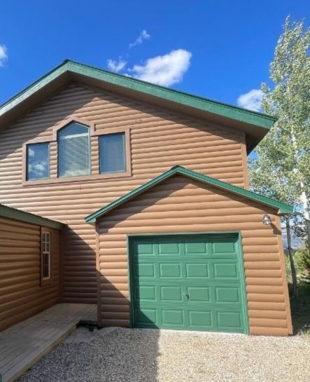 An image of a freshly painted house that highlights the value of exterior painting in Denver CO, improving curb appeal and increasing property value for homeowners.