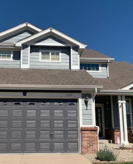 Image of a house with beautifully painted exteriors, reflecting the high standards, durability, and visual appeal delivered by professional painters.