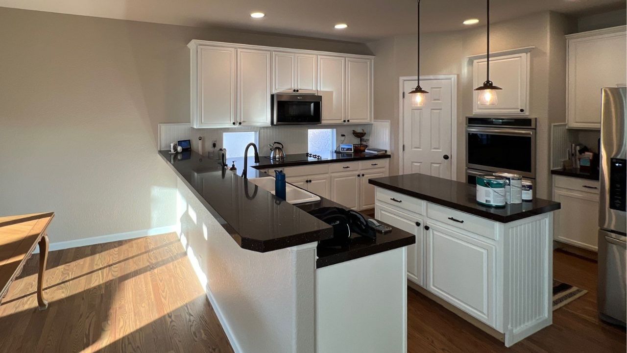 Freshly painted kitchen cabinets showcasing a smooth, high-quality finish—demonstrating the attention to detail and custom results delivered by professional painters in Denver, CO.