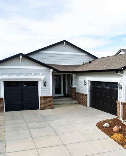 A clean and modern exterior residential painting project completed by Elk Horn Painting in Denver, featuring sharp contrasts and updated curb appeal.