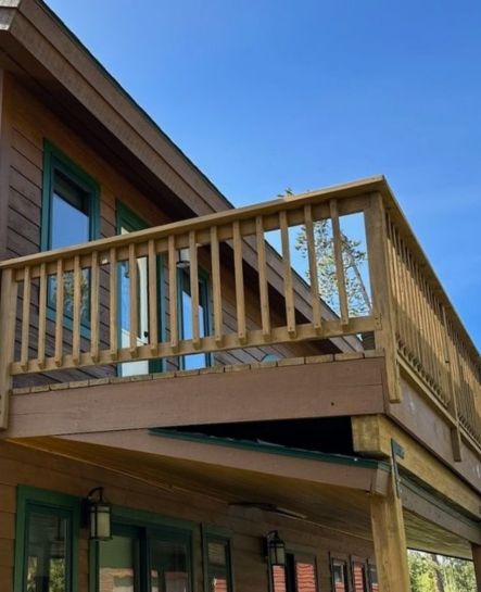 A natural wood deck and railing ready for staining or painting, part of Elk Horn Painting – Denver’s outdoor enhancement services.