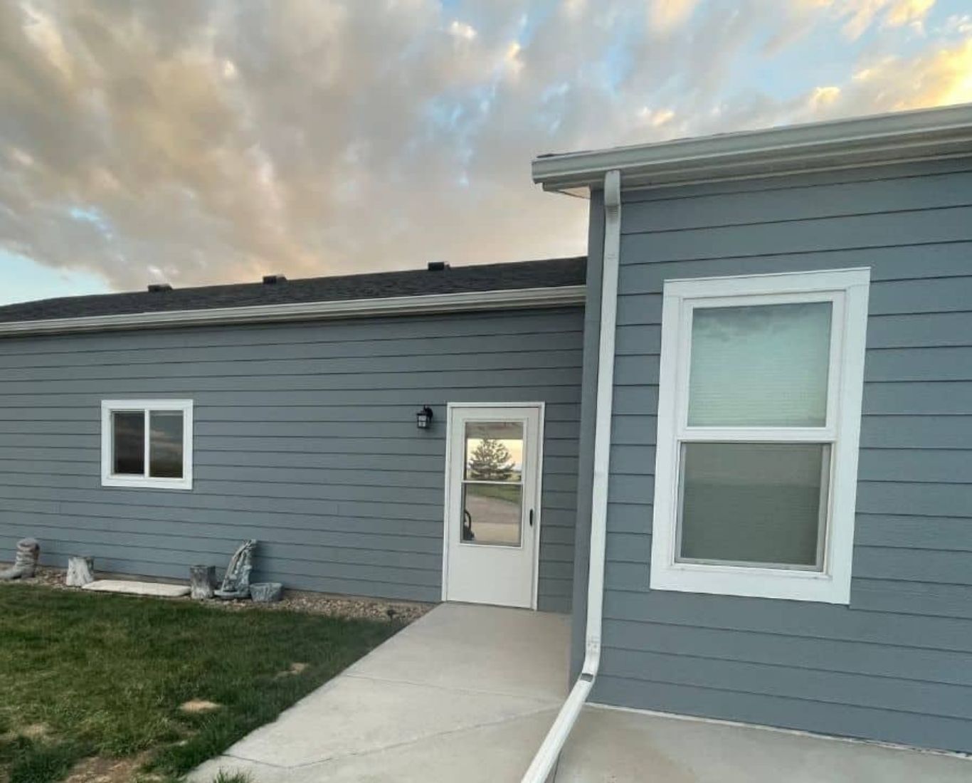 Professional painter carefully coating exterior trim with precise brushwork and preparation. Exterior Painting near me.